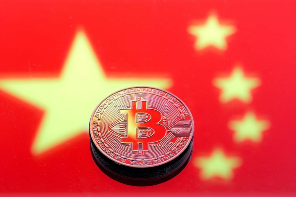 coins Bitcoin, against the background of the Chinese flag, conce