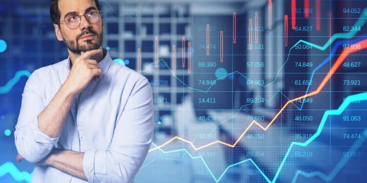 attractive-thoughtful-young-businessman-with-glowing-forex-chart-blurry-bokeh-office-interior-background-trade-finance-market-concept-double-exposure