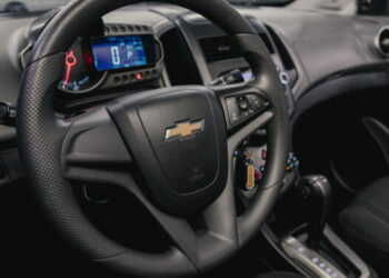 Novosibirsk/ Russia – August 25  2020: Chevrolet Aveo, Prestige car interior with dashboard, steering wheel, speedometer and tachometer. Black leather interior.