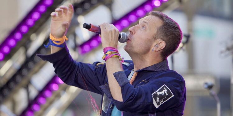 Por que o Coldplay é tão amado? A banda que emociona multidões!
