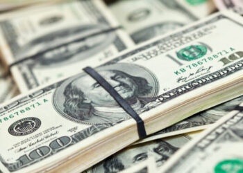 Background of many US dollars banknotes