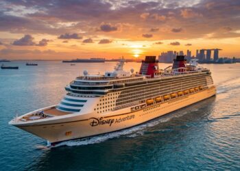 O Disney Adventure, hoje o maior navio já operado pela Disney Cruise Line, ficou parado por meses em um estaleiro alemão, abandonado após uma falência bilionária, antes de ser adquirido por uma fração do seu custo real e transformado em uma das experiências náuticas mais sofisticadas do mundo